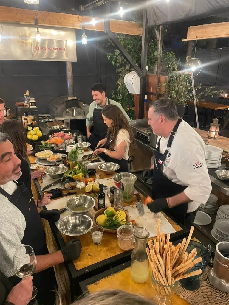 Guests cooking with a Chilean chef during a private cooking class