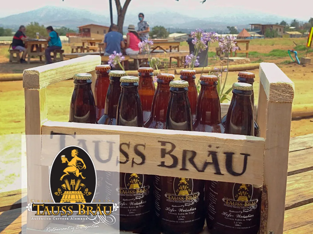 Crate of TaussBräu craft beer in the beer garden in Limache