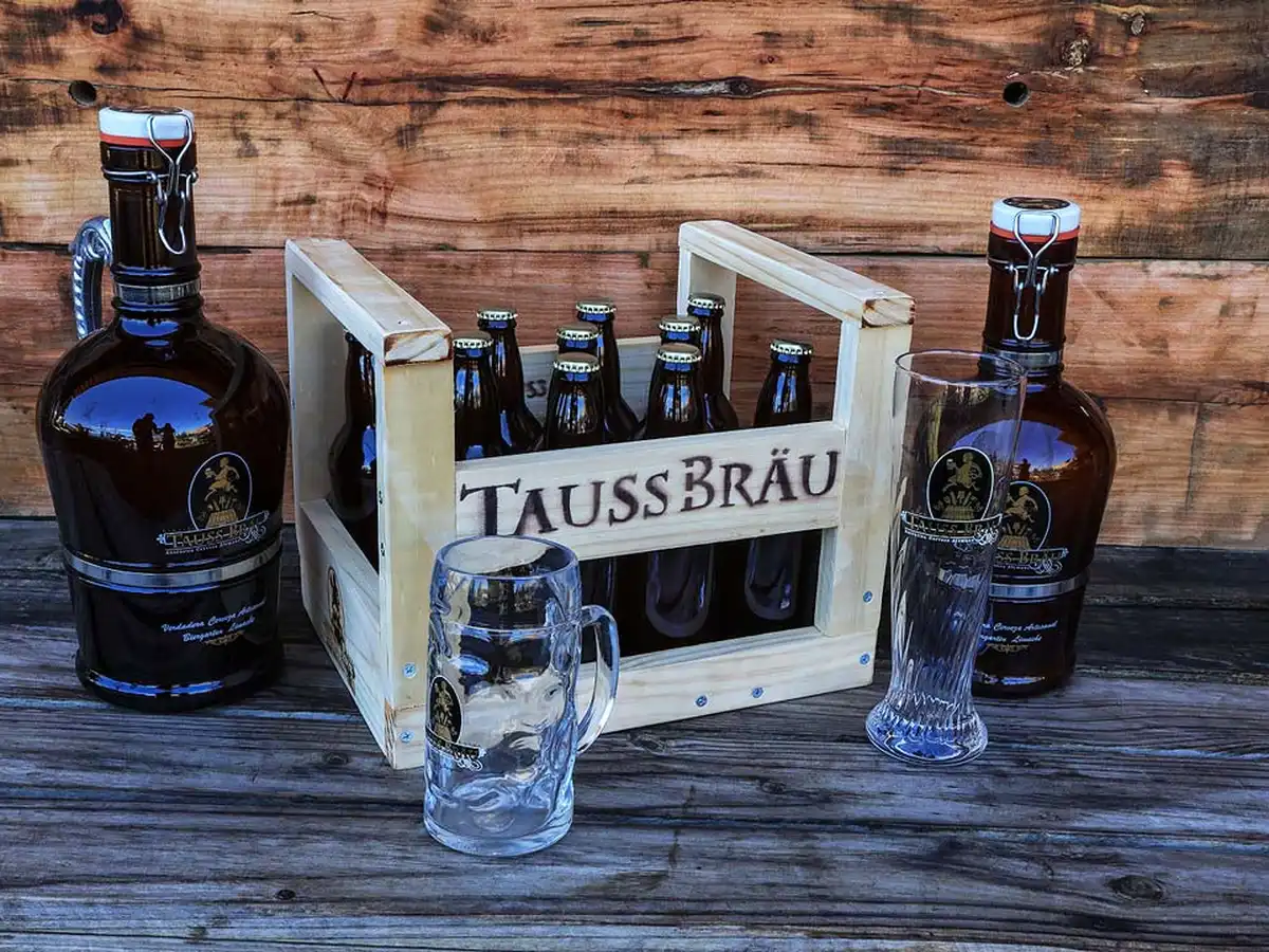 TaussBräu craft beer bottles, growlers and glasses
