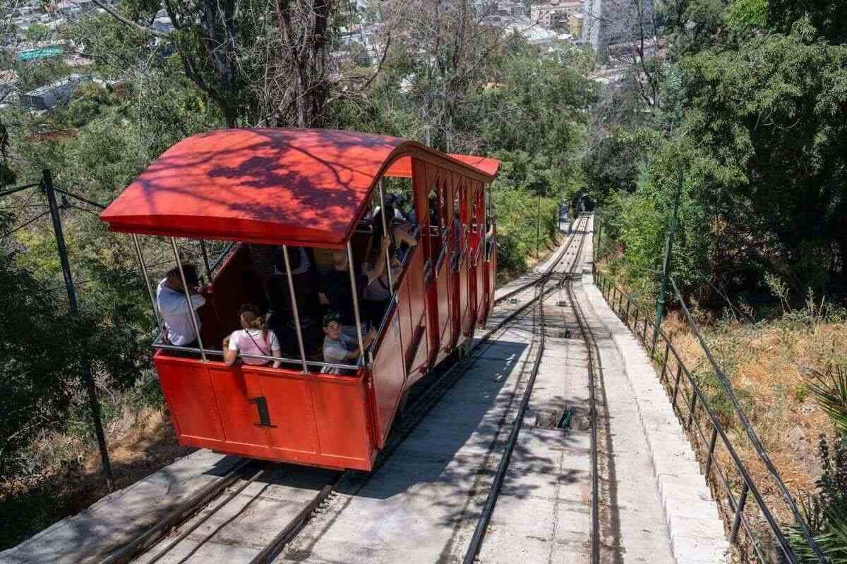 Red funicular climbing San Cristóbal Hill in Santiago