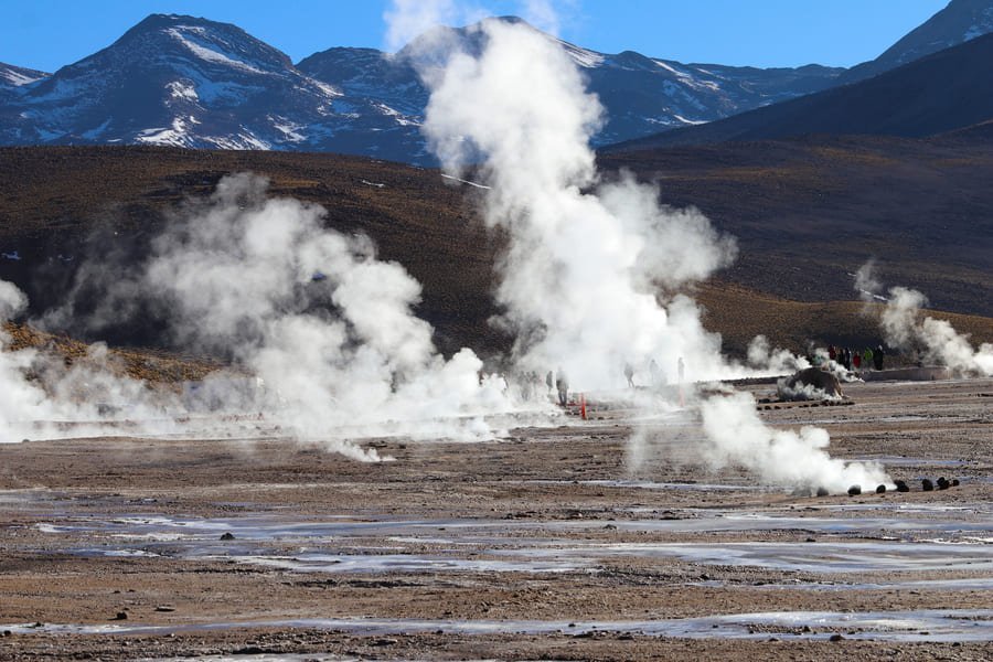 El Tatio geysers steaming at sunrise