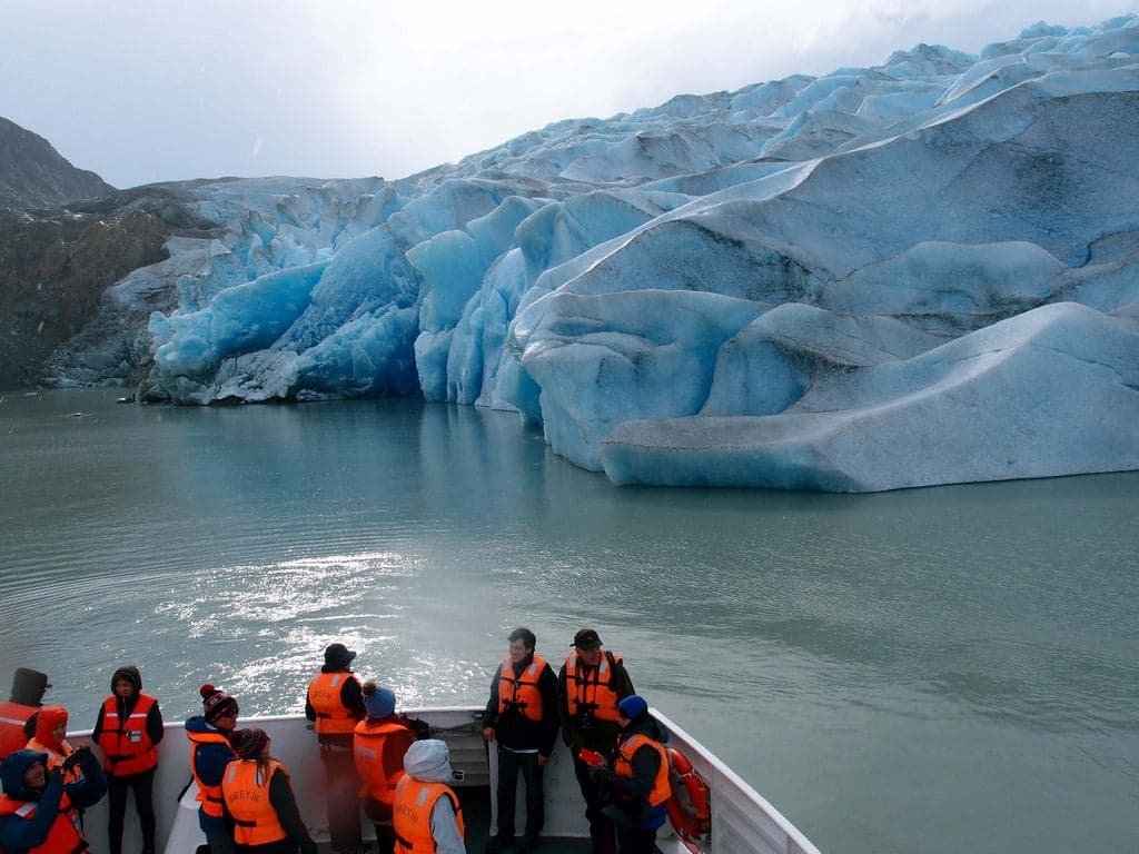 Boat deck in front of the blue ice of Grey Glacier