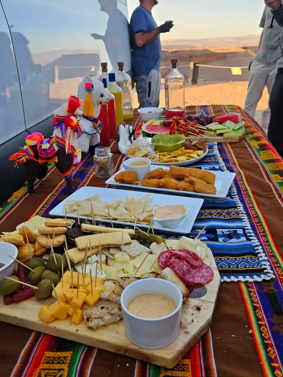Sunset picnic with wine and snacks in the Atacama Desert