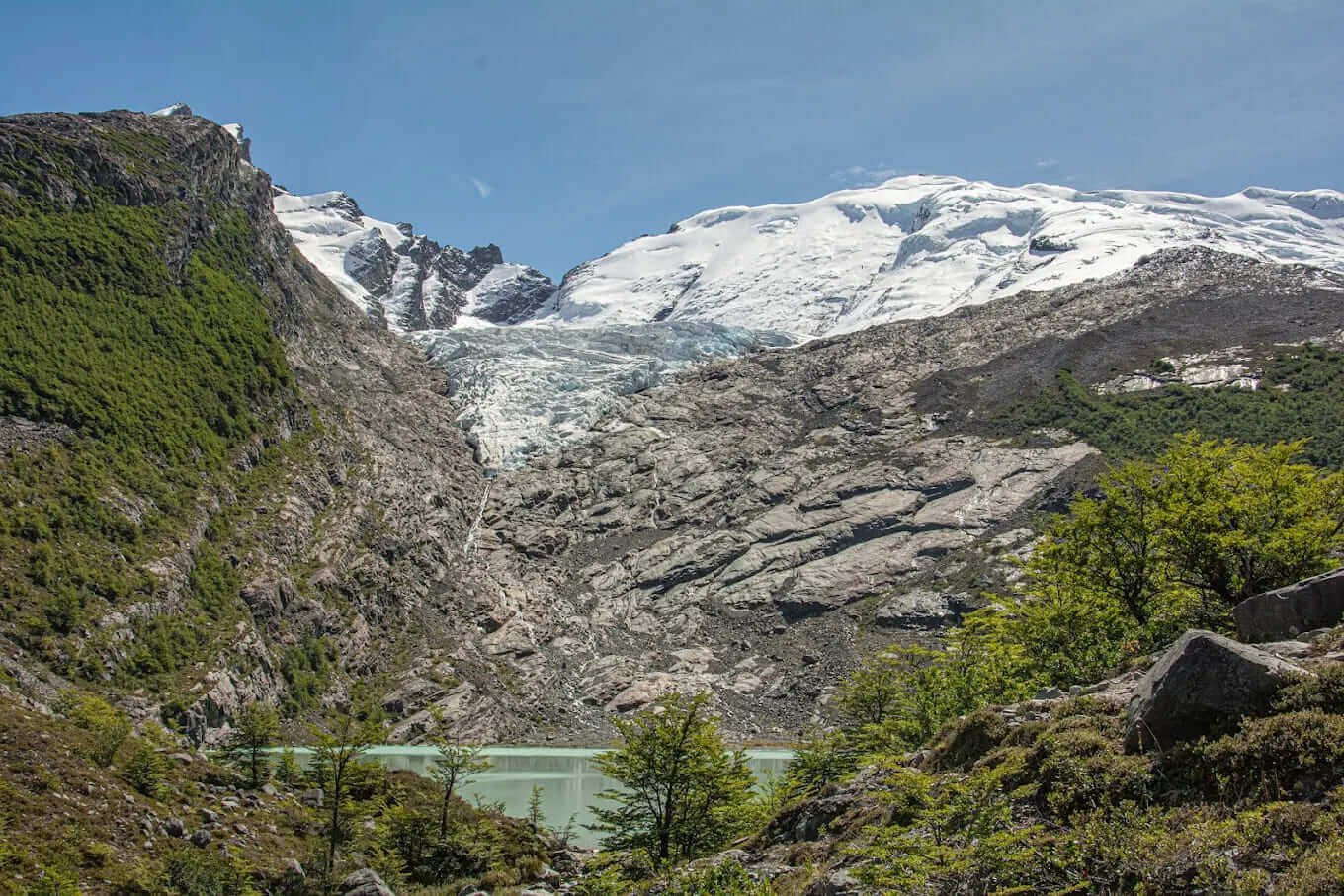 Huemul Glacier descending toward the turquoise Laguna Huemul, Patagonia