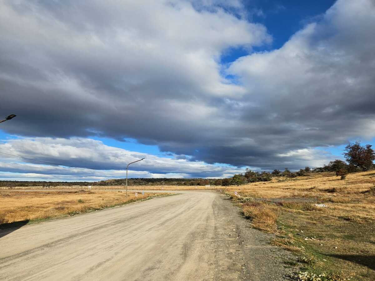 Gravel road across the open steppe between Argentina and Chile