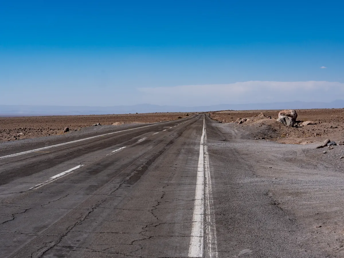 Straight desert road across the Atacama on the way to San Pedro de Atacama