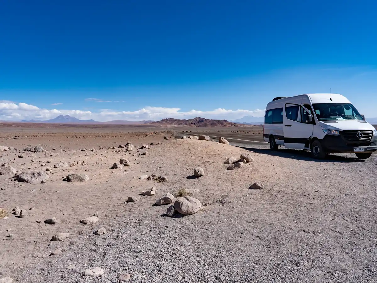 Private transfer minibus on the desert road between Calama and San Pedro de Atacama