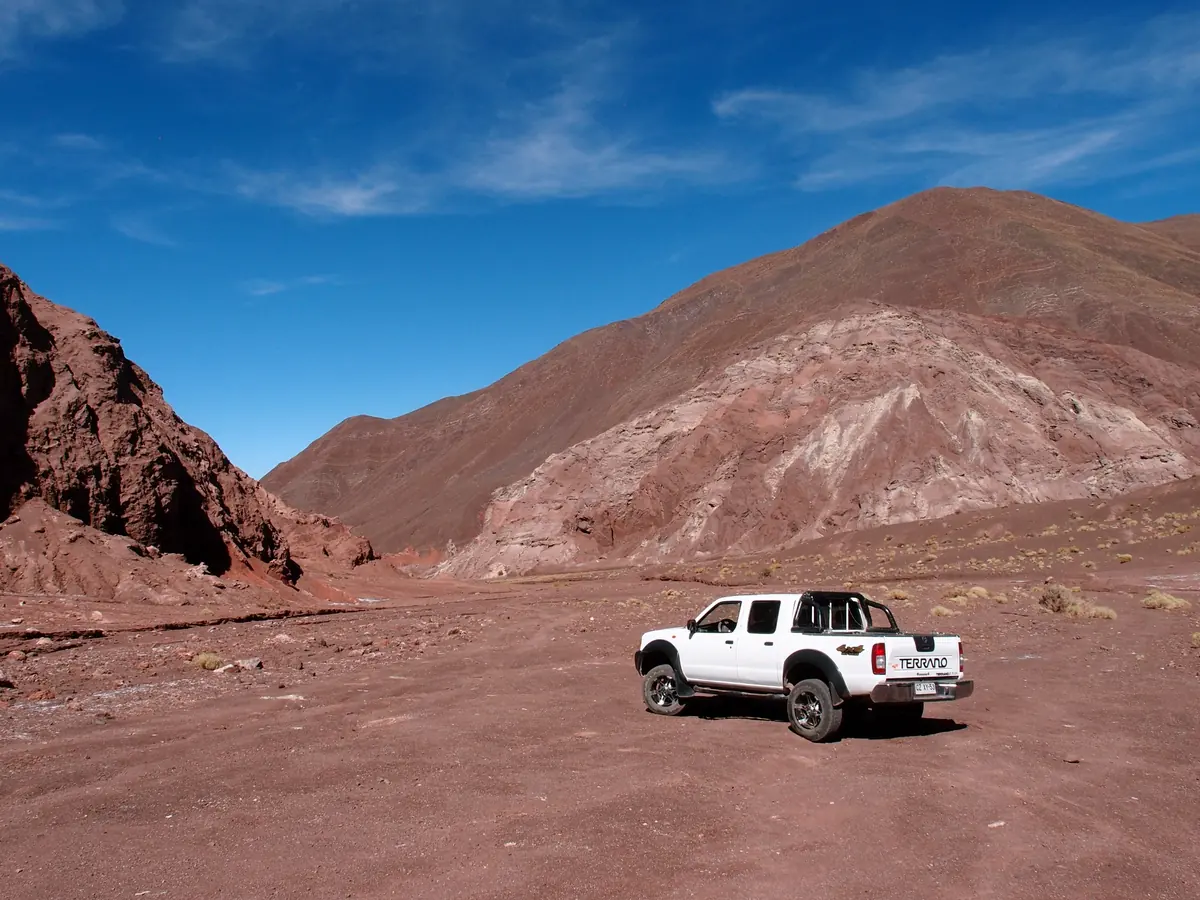 Red and white mountain slopes of Rainbow Valley in the Atacama Desert