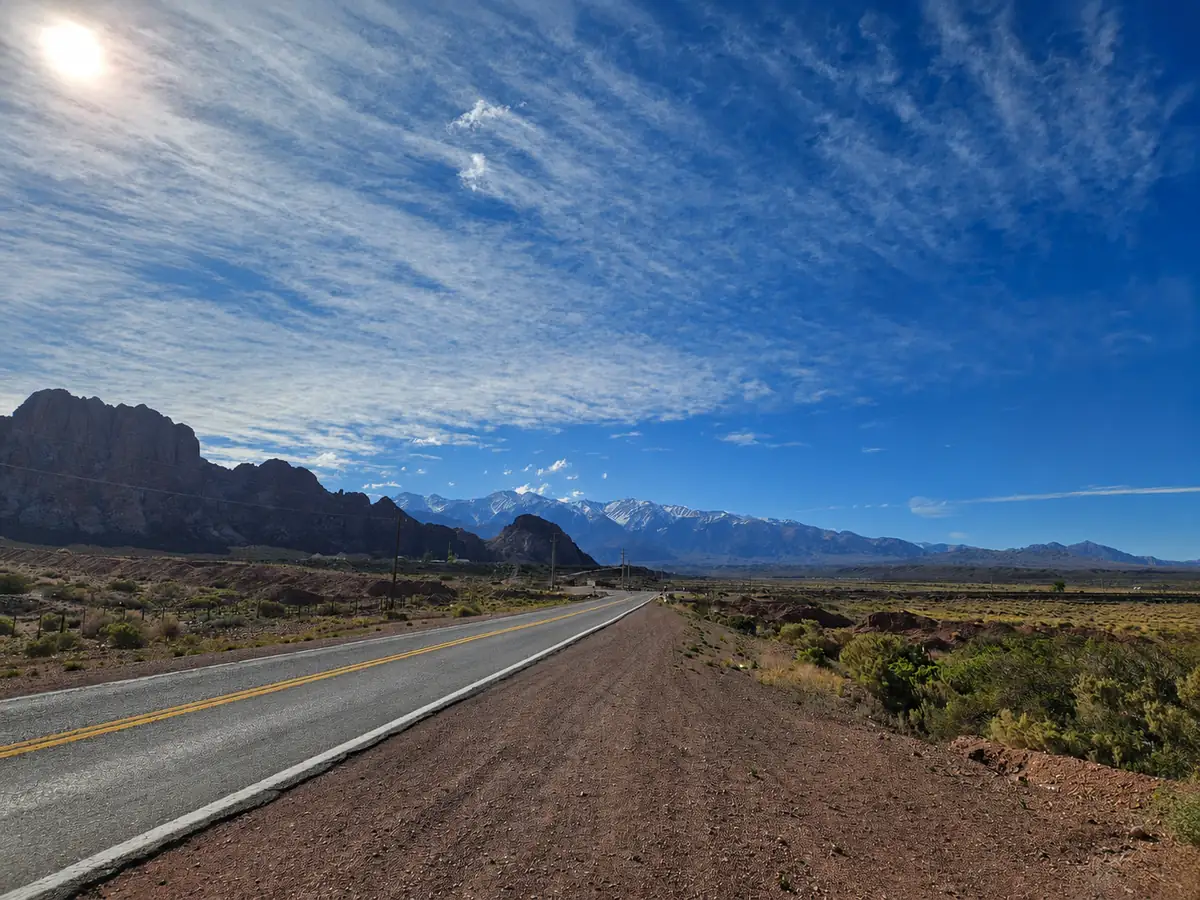 Open road toward the snow-capped Andes on the way from Valparaíso to Mendoza
